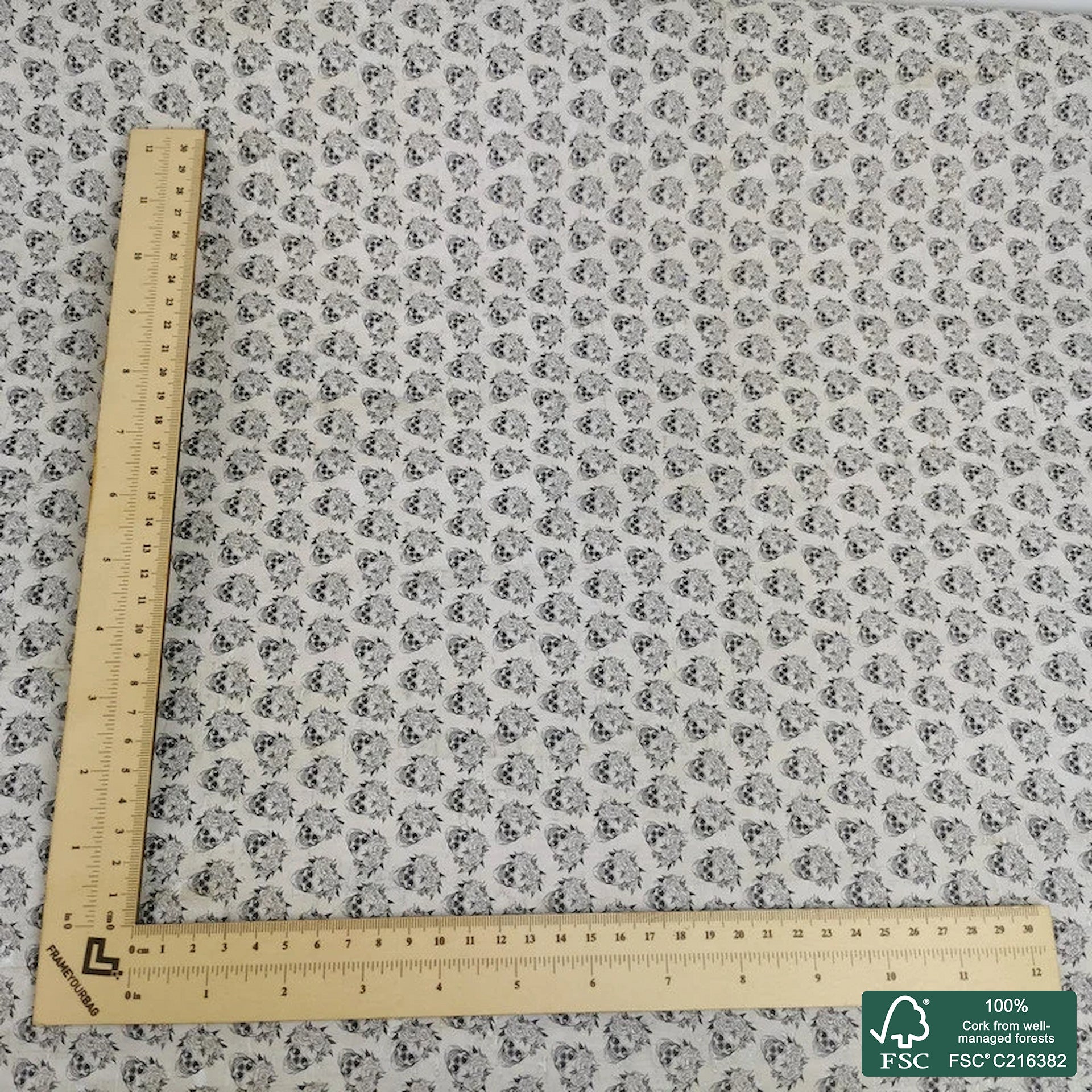 Skulls printed pattern on white cork fabric (411)