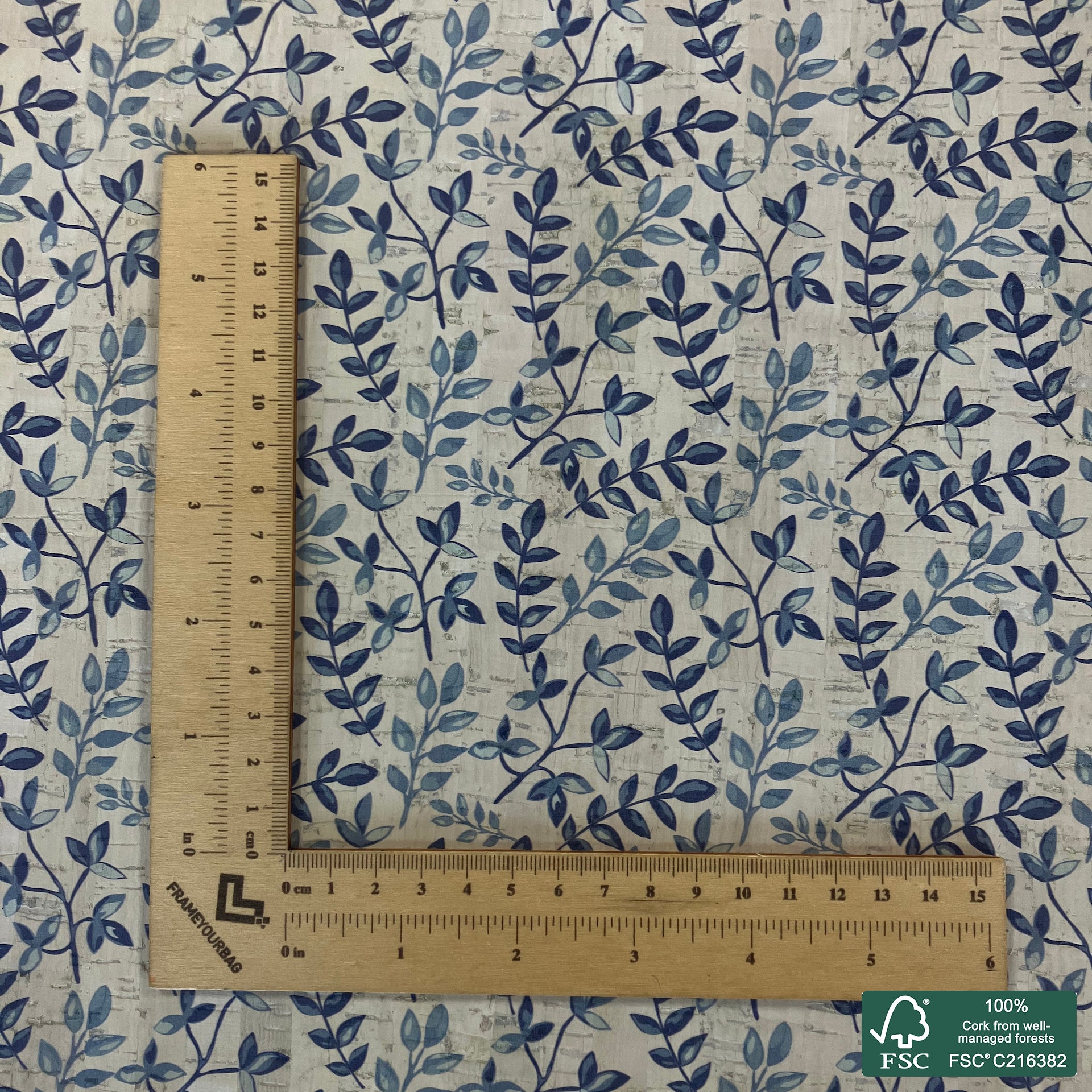 Leaves printed pattern on white cork fabric (548)