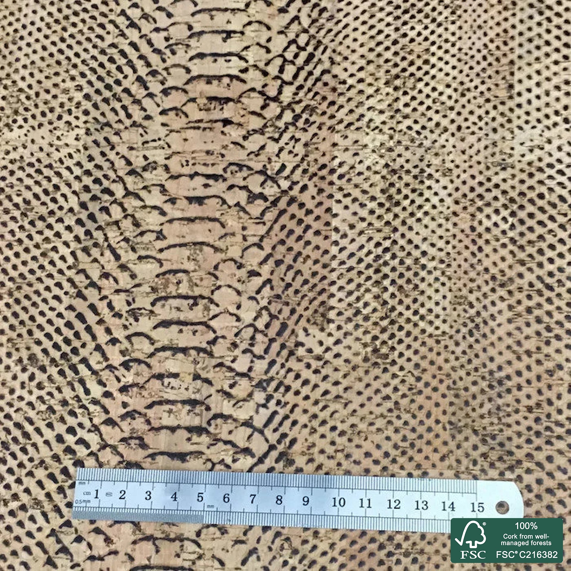 Piton embossed on natural rustic cork fabric