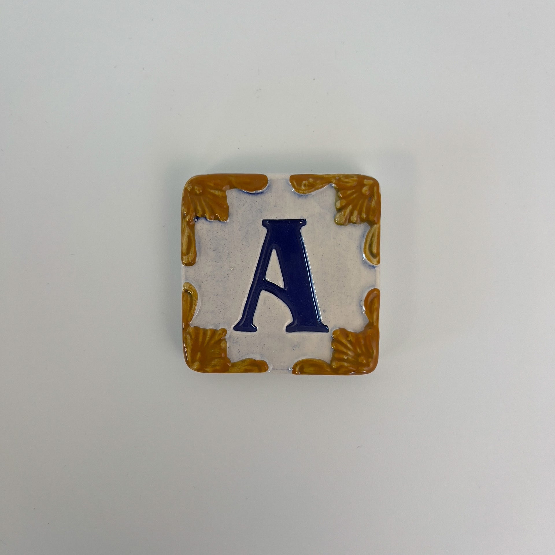 Ceramic door number and letter tile