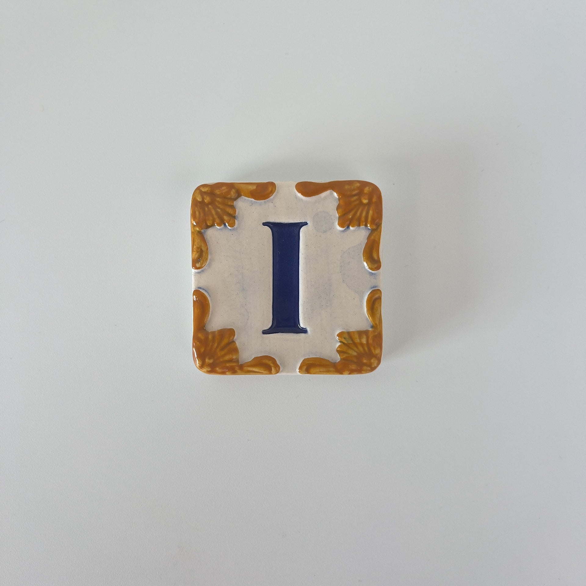 Ceramic door number and letter tile