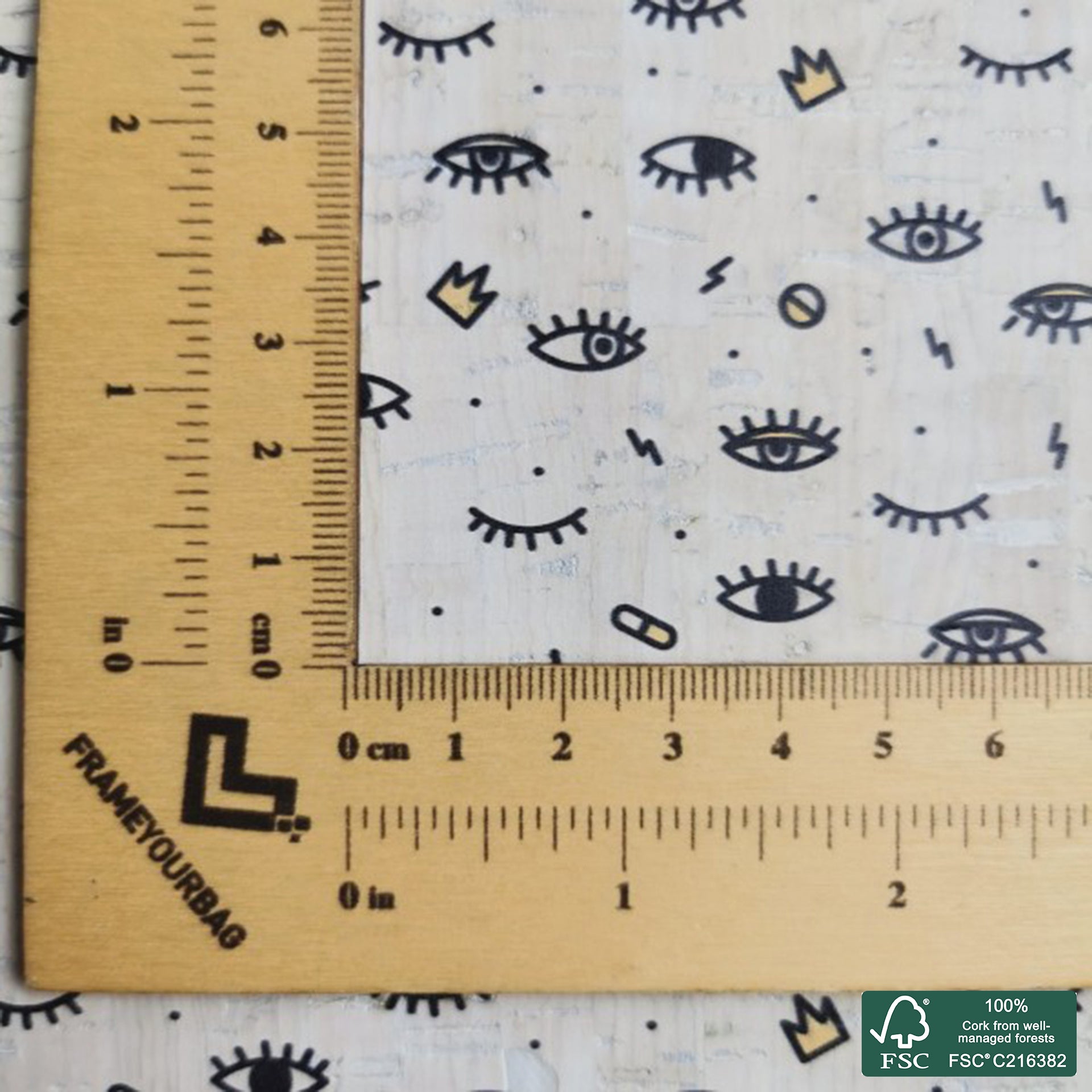 Eye printed pattern on white cork fabric (211)